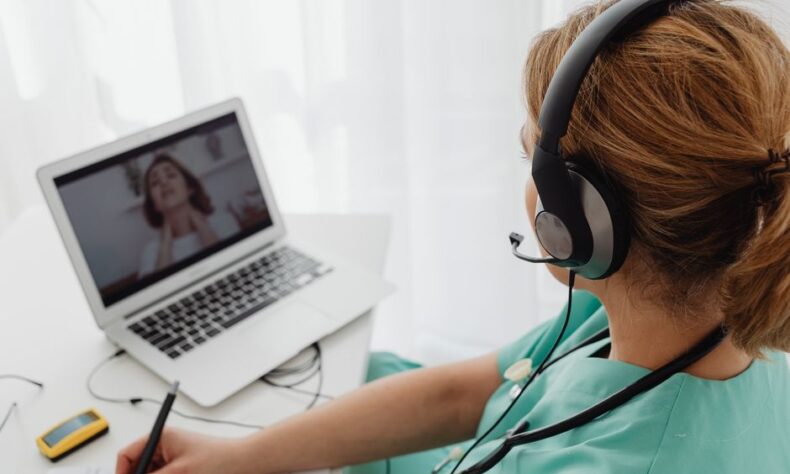 Medical professional consulting a patient online via laptop for telehealth services. - Photo by https://kaboompics.com/ on Pexels